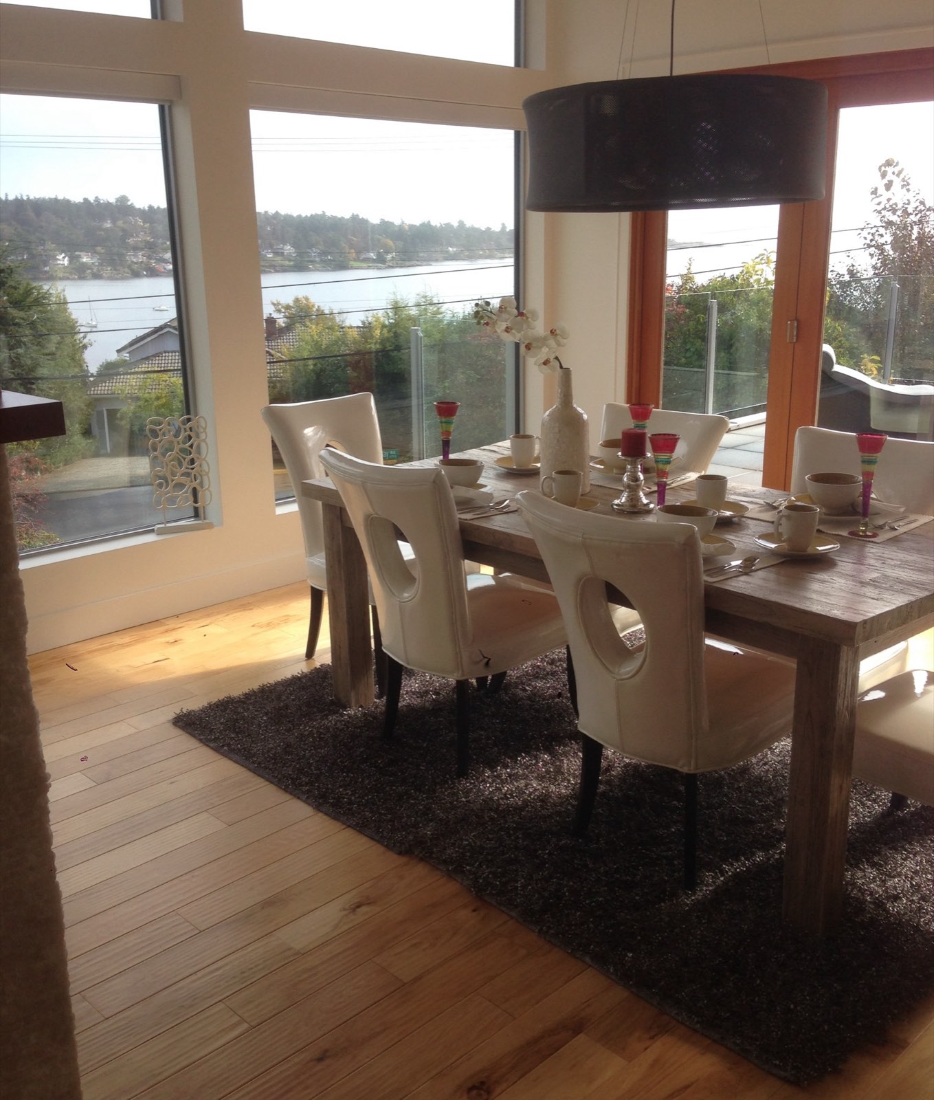 Dining room with water view and light hardwood floor
