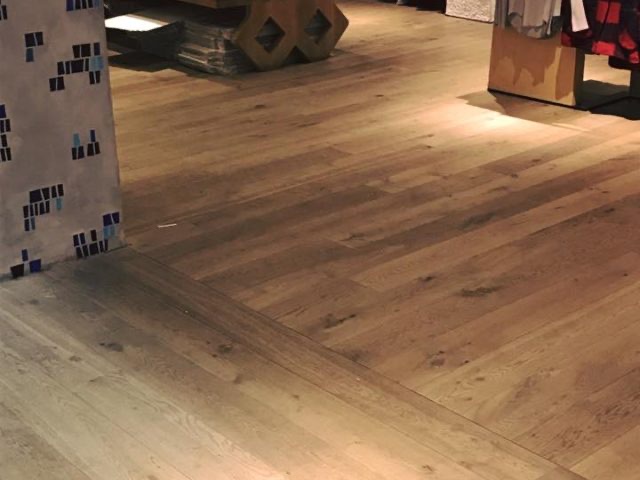 Chevron-patterned oak flooring in an office space