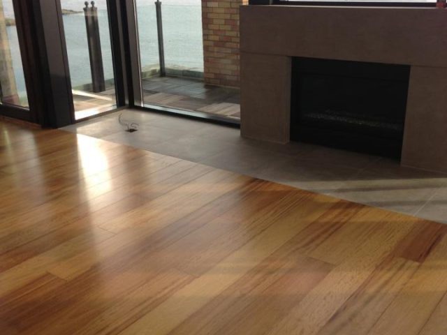 Hardwood floor meeting a fireplace hearth